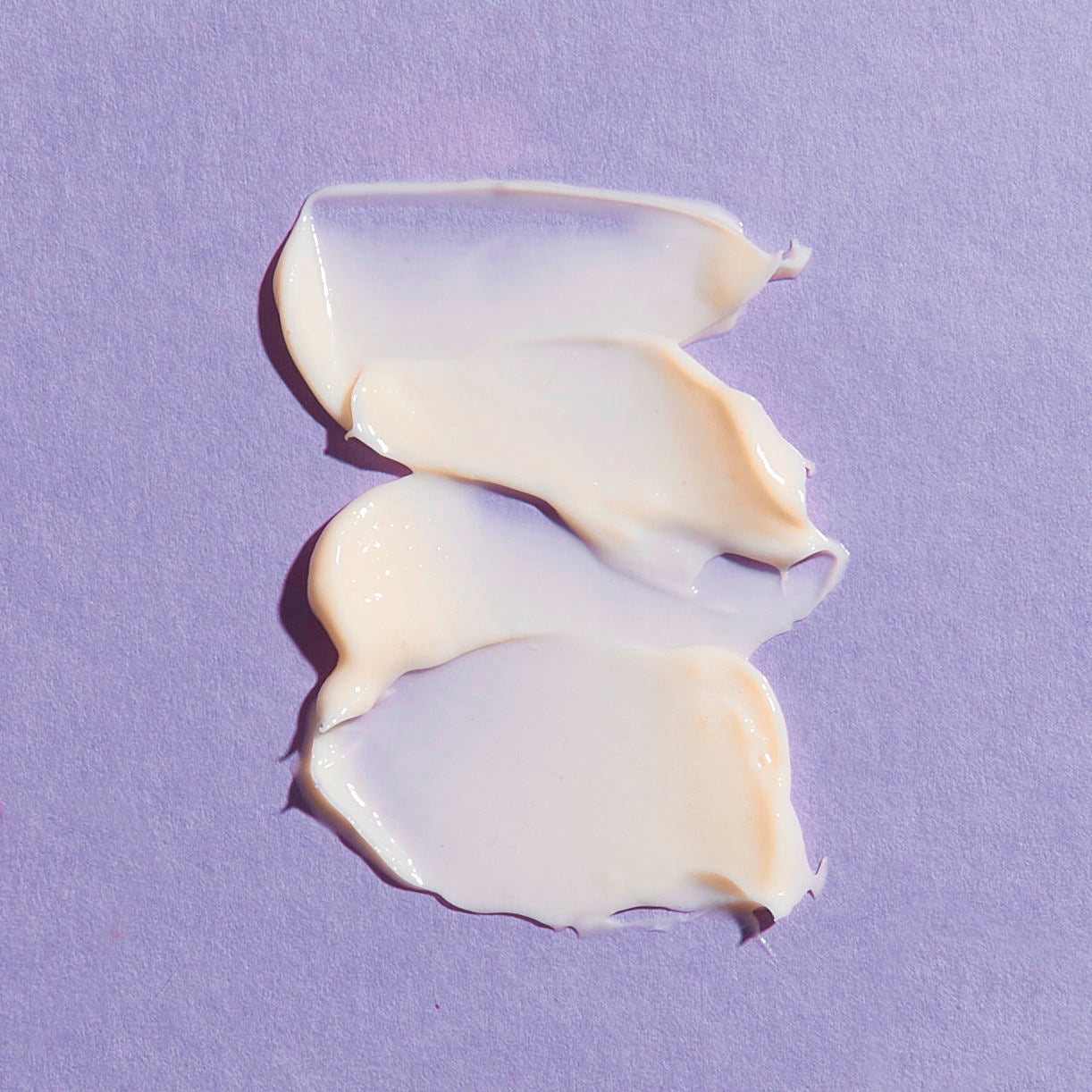 Close-up smear of skincare product. Image of REPLENIX Age Restore Retinol Eye Repair is a powerful, age-defying retinol eye treatment enriched with an advanced blend of collagen-boosting peptides proven to reduce the appearance of fine lines, wrinkles, dark circles, and puffiness under the eye.