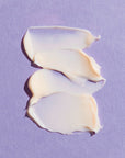 Close-up smear of skincare product. Image of REPLENIX Age Restore Retinol Eye Repair is a powerful, age-defying retinol eye treatment enriched with an advanced blend of collagen-boosting peptides proven to reduce the appearance of fine lines, wrinkles, dark circles, and puffiness under the eye. 