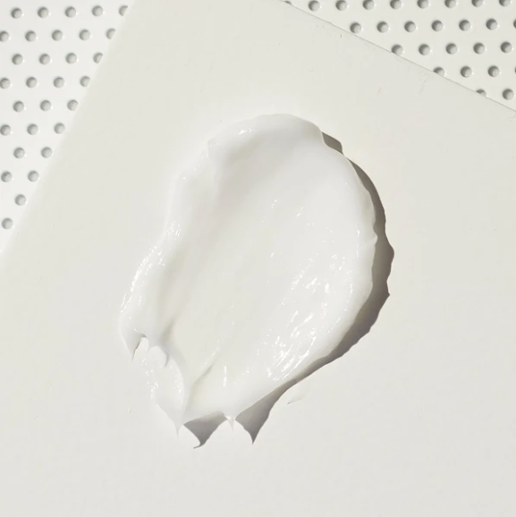Close up image of smear of skincare product. REPLENIX Age Restore Nighttime Therapy.